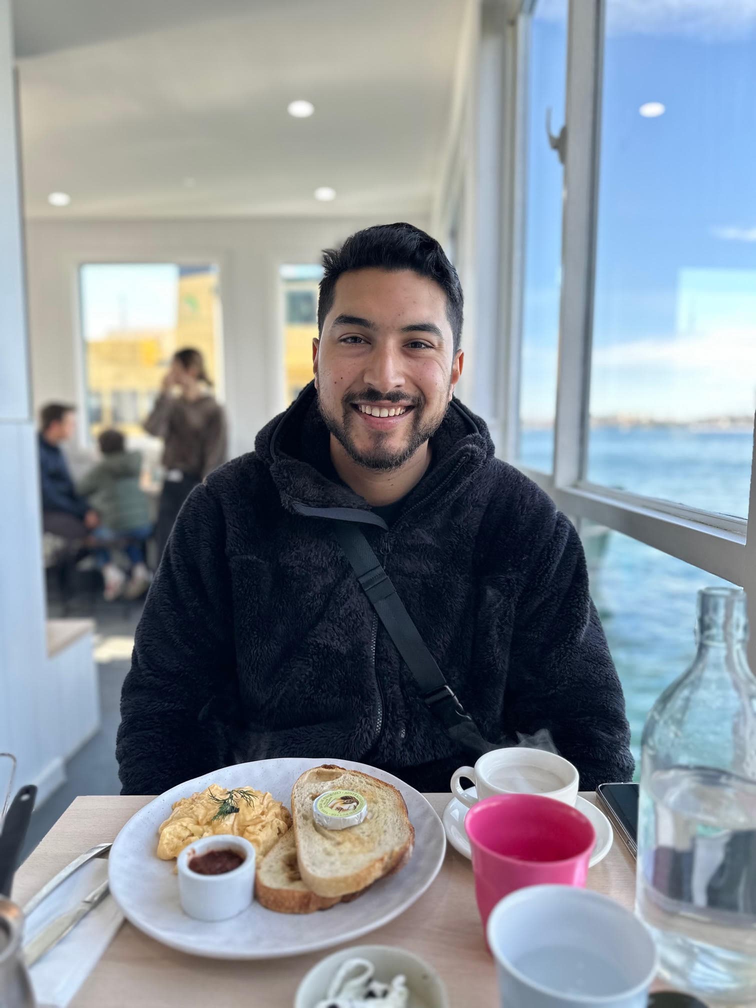 Portrait of Dr. Khan smiling in professional attire