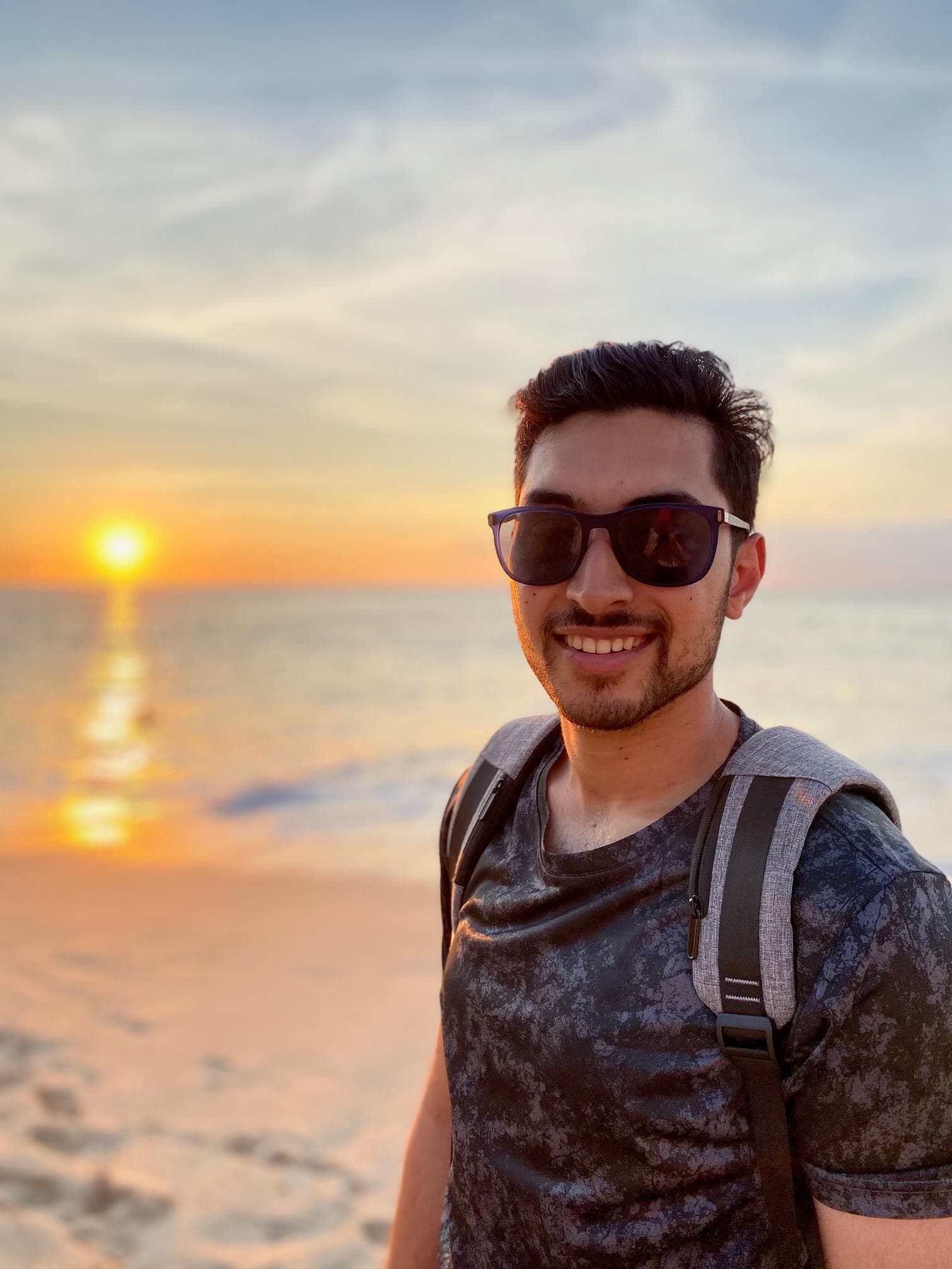 Dr. Naazil Khan engaging in warm, attentive conversation with a patient in a calming clinic environment.